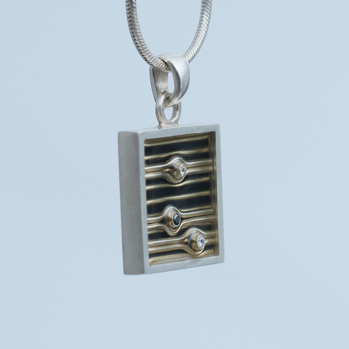 Dusk – handmade sterling silver pendant by Matthew Street Jewellery, view 2