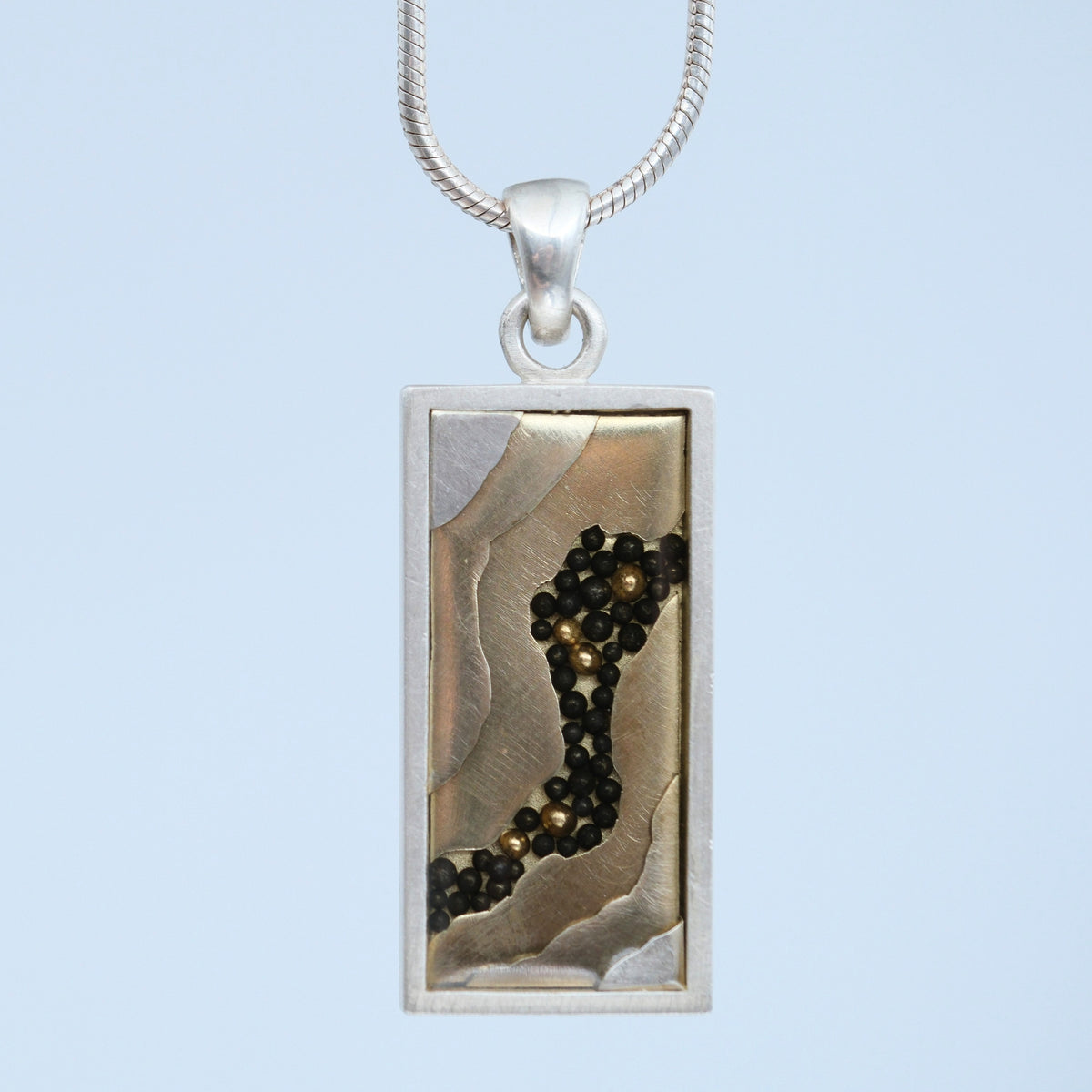 River Nuggets – handmade gold & silver pendant by Matthew Street Jewellery