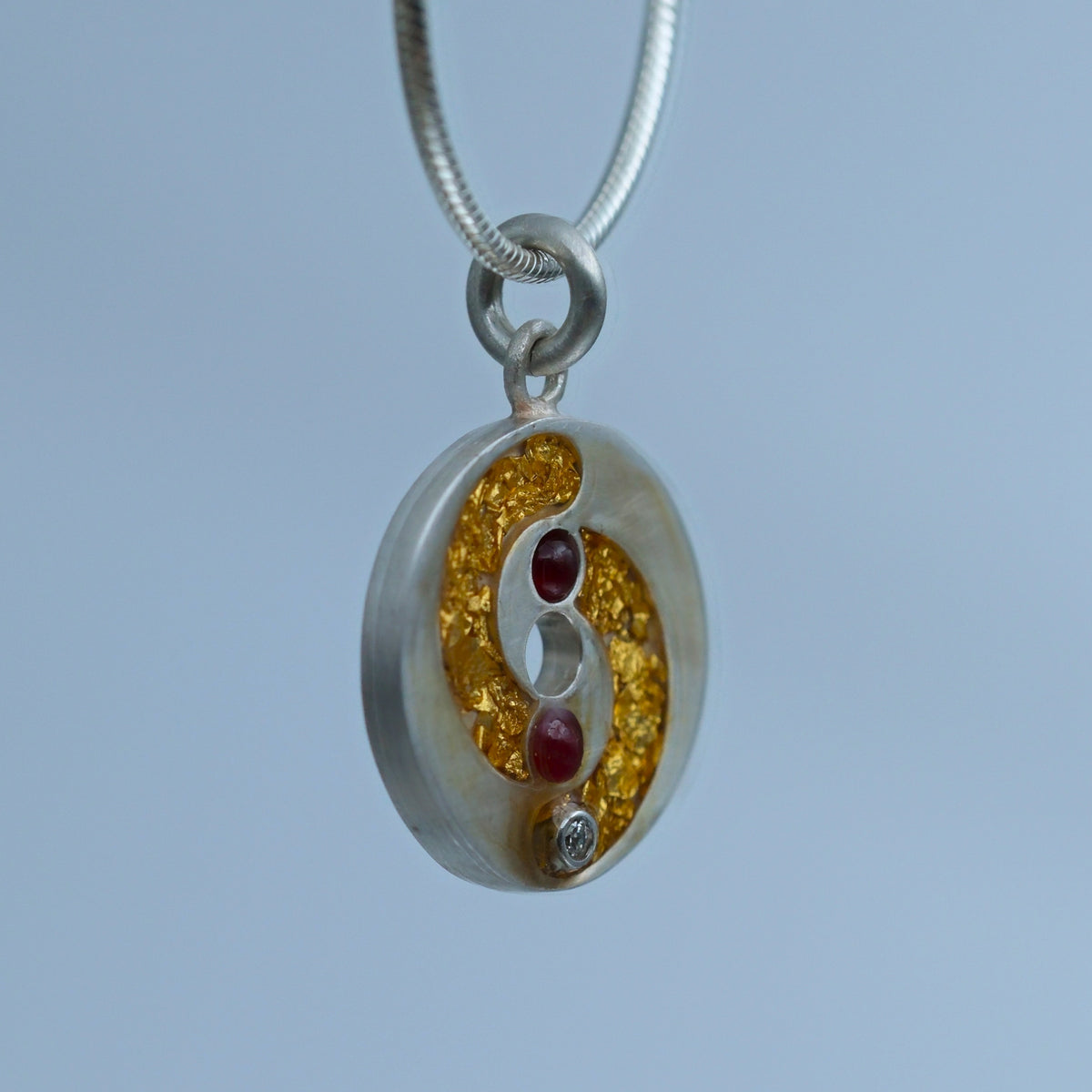 Golden Spiral – handmade gold & silver pendant by Matthew Street Jewellery, view 2