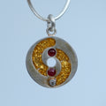 Golden Spiral – handmade gold & silver pendant by Matthew Street Jewellery
